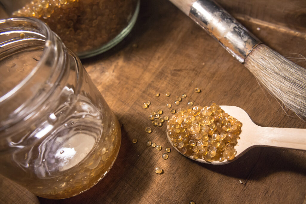 Animal,Glue,Granules,For,Restoration,On,A,Wooden,Spoon,,A